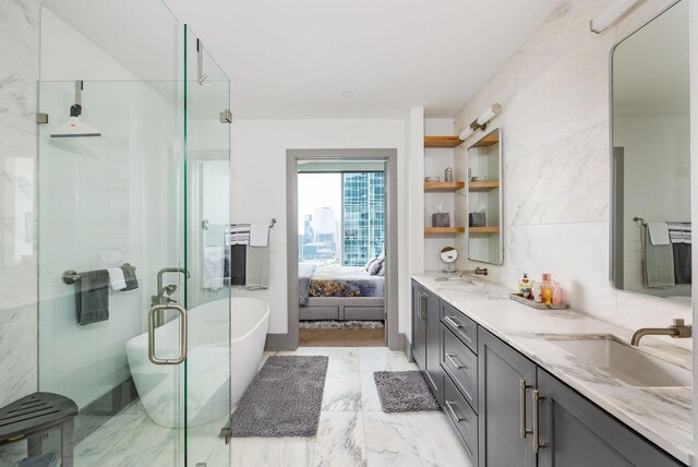 1616 W End Ave Unit 1803, Nashville, TN 37203 - bathroom with a soaking tub, a sink, double vanity, and a stall shower