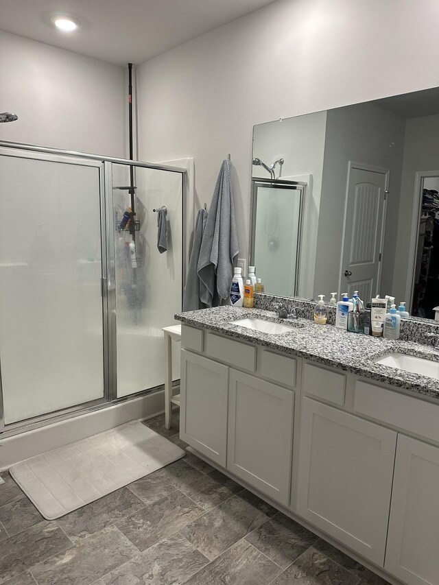 278 Addison Ave, Chapel Hill, TN 37034 - bathroom featuring double vanity, a shower stall, a closet, and a sink