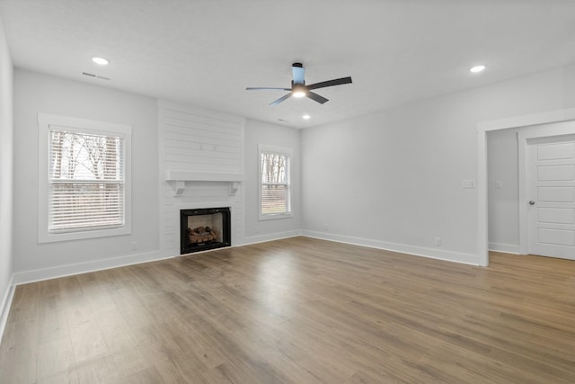 978 Alton Dr, Clarksville, TN 37043 - unfurnished living room with ceiling fan, baseboards, wood finished floors, and visible vents