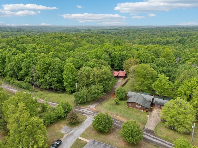 aerial view featuring a wooded view