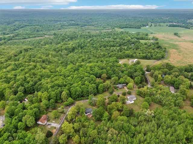 drone / aerial view with a view of trees