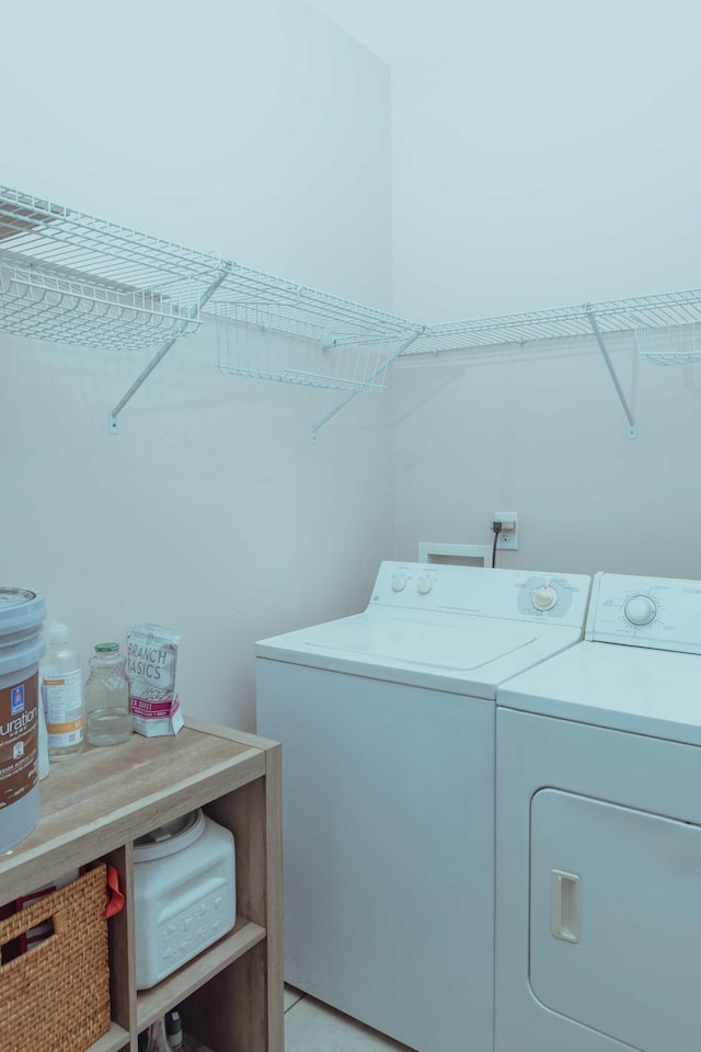 laundry room with independent washer and dryer and laundry area