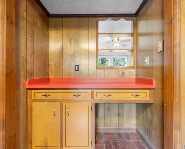 interior details featuring wood walls and ceiling fan