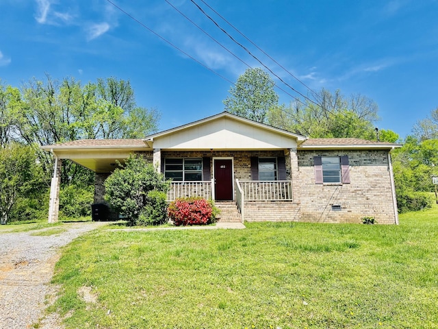view of front of home with crawl space, a front lawn, driveway, a porch, and brick siding