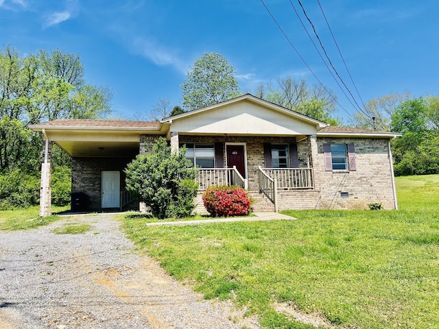 view of front of house with a front lawn, a carport, driveway, a porch, and brick siding