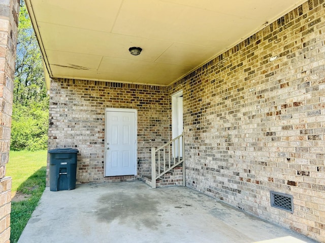 view of patio featuring visible vents and entry steps