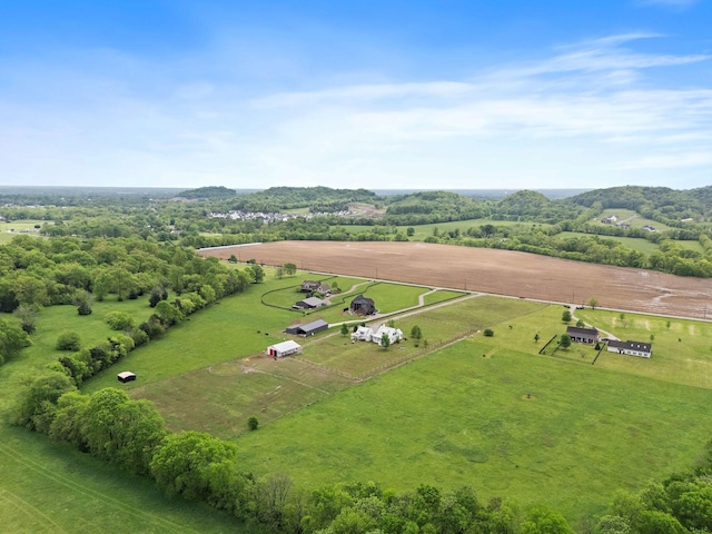 birds eye view of property with a rural view