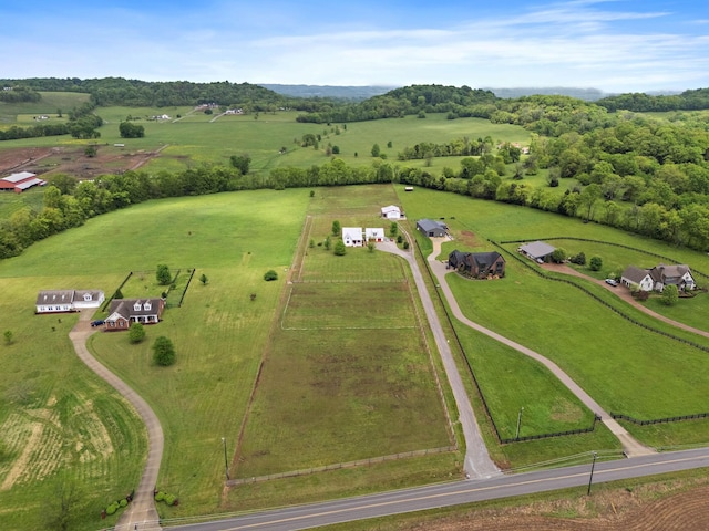 birds eye view of property with a rural view