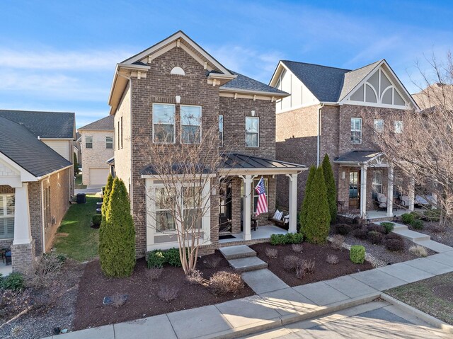 131 Benjamin Ln, Hendersonville, TN 37075 - view of front facade with brick siding, a standing seam roof, and metal roof