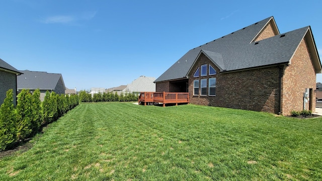 view of yard with a wooden deck