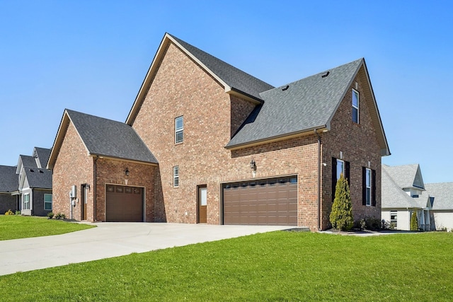 view of home's exterior with a lawn, a shingled roof, driveway, and brick siding