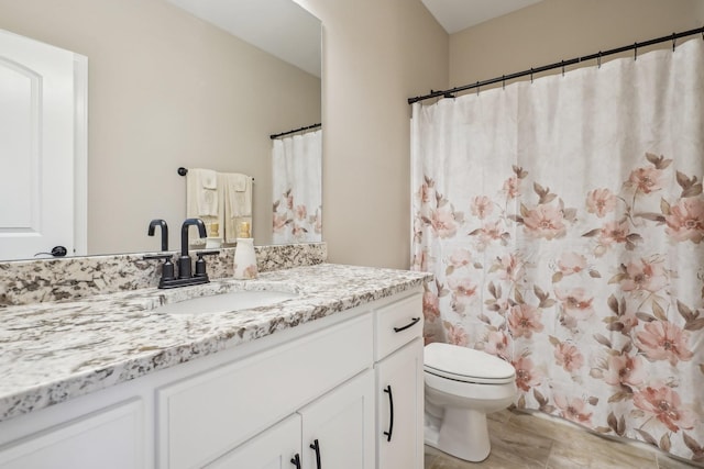 full bathroom with vanity and toilet