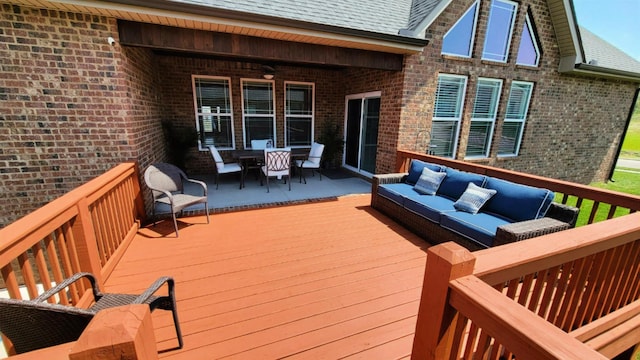wooden terrace featuring outdoor lounge area and outdoor dining space