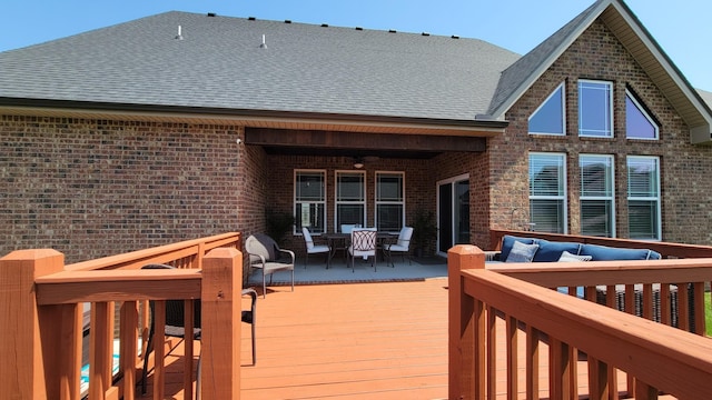 deck with outdoor dining space and an outdoor hangout area