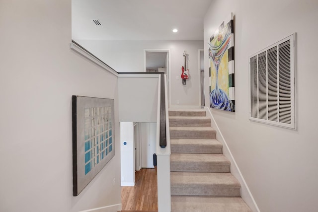 516 Harpeth Trace Dr, Nashville, TN 37221 - stairs featuring wood finished floors, baseboards, visible vents, and recessed lighting