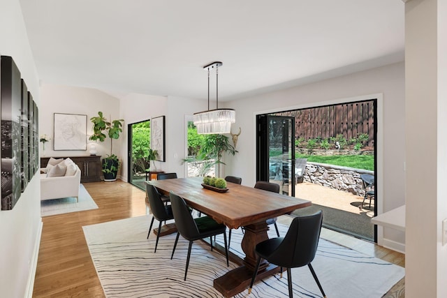 516 Harpeth Trace Dr, Nashville, TN 37221 - dining area featuring light wood-type flooring and a chandelier