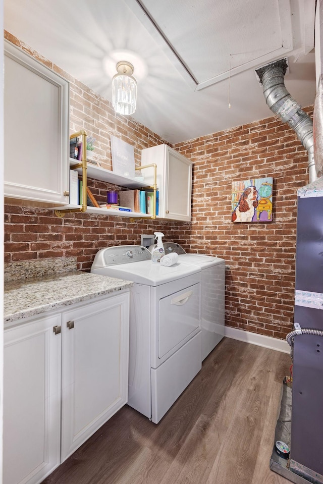 516 Harpeth Trace Dr, Nashville, TN 37221 - washroom featuring independent washer and dryer, wood finished floors, baseboards, and brick wall