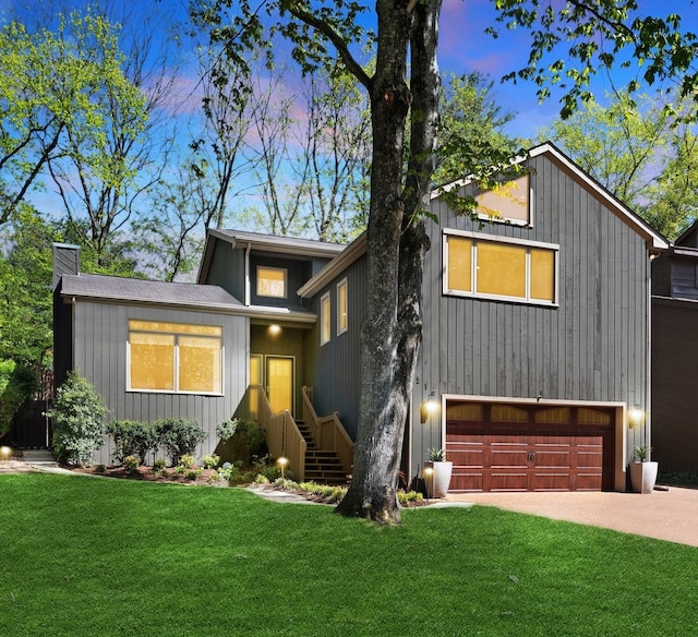 516 Harpeth Trace Dr, Nashville, TN 37221 - view of front of house with a garage, driveway, a chimney, and a front yard