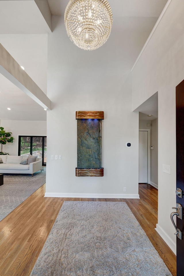 516 Harpeth Trace Dr, Nashville, TN 37221 - foyer entrance with baseboards, a notable chandelier, a high ceiling, and wood finished floors