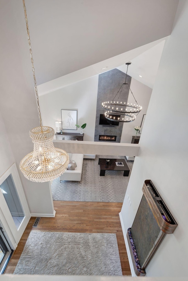 516 Harpeth Trace Dr, Nashville, TN 37221 - interior space featuring a large fireplace, a notable chandelier, baseboards, and wood finished floors