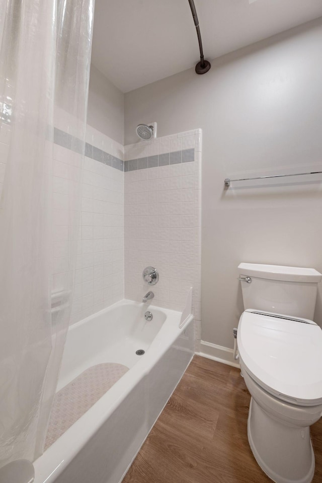 516 Harpeth Trace Dr, Nashville, TN 37221 - bathroom featuring shower / bathtub combination with curtain, baseboards, wood finished floors, and toilet