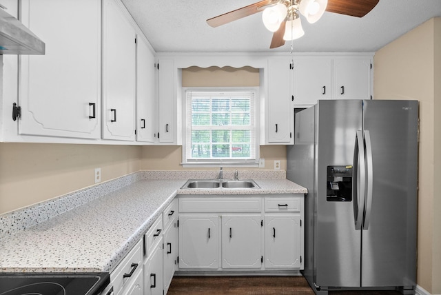 2041 Dotsonville Rd, Clarksville, TN 37042 - kitchen with white cabinets, stainless steel fridge with ice dispenser, a ceiling fan, a sink, and wall chimney exhaust hood
