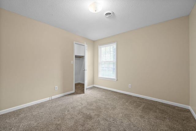 2041 Dotsonville Rd, Clarksville, TN 37042 - unfurnished bedroom featuring a textured ceiling, baseboards, visible vents, a closet, and carpet floors