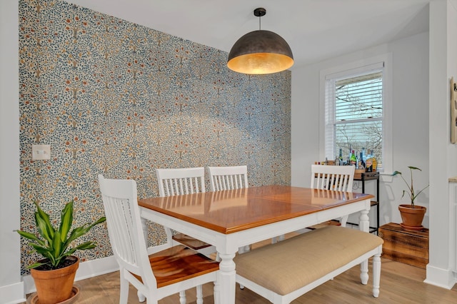 dining room with wood finished floors and baseboards