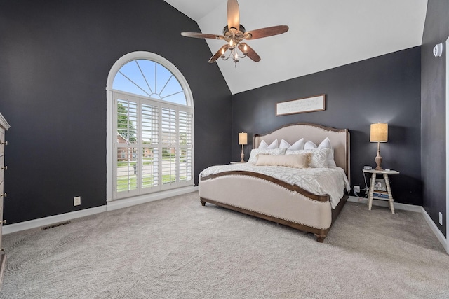 carpeted bedroom with visible vents, a ceiling fan, high vaulted ceiling, and baseboards