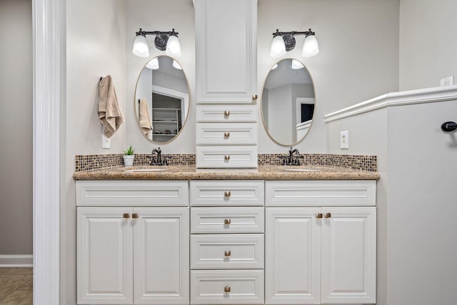 full bathroom featuring double vanity and a sink