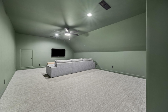 additional living space featuring ceiling fan, carpet flooring, vaulted ceiling, and baseboards