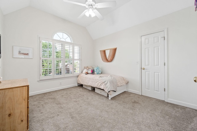 carpeted bedroom with baseboards, a ceiling fan, and vaulted ceiling