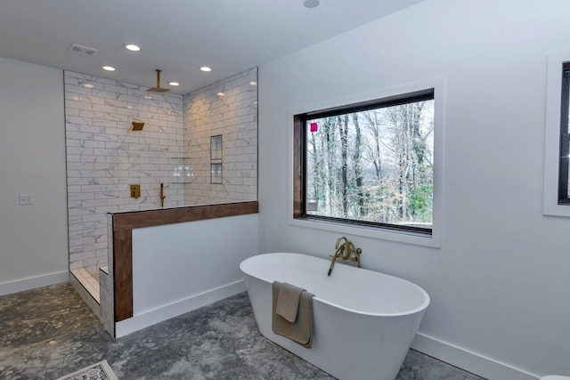 bathroom featuring baseboards, recessed lighting, a freestanding tub, a fireplace, and a walk in shower