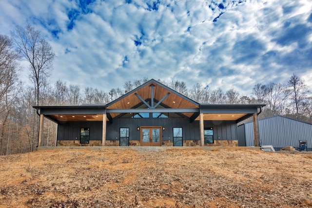 back of property featuring french doors