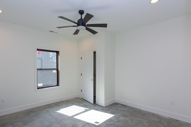 empty room with recessed lighting, concrete floors, and visible vents