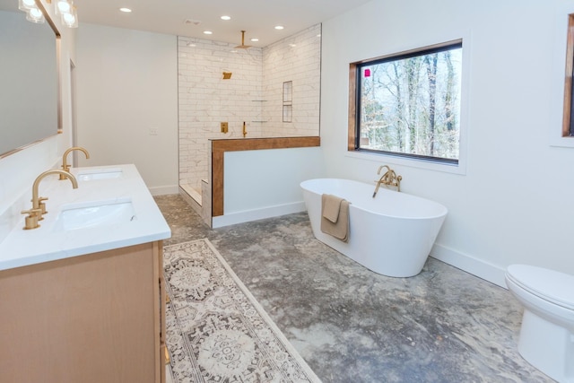 full bath featuring double vanity, walk in shower, a soaking tub, and a sink