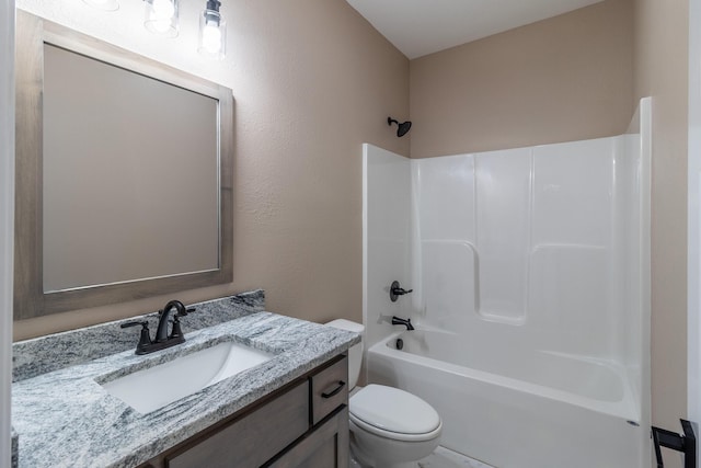 full bath featuring shower / washtub combination, vanity, and toilet