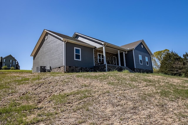 rear view of property with a porch