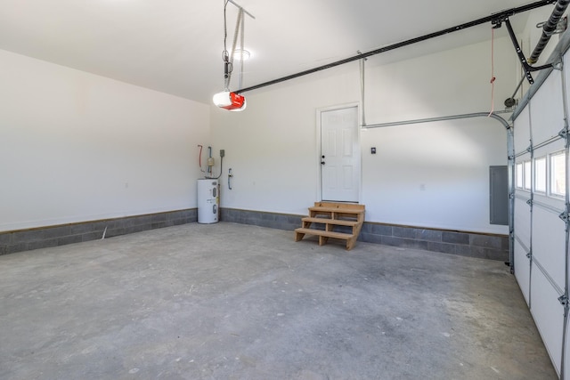 garage with a garage door opener and electric water heater