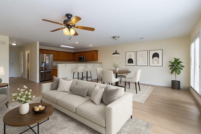 4982 W Valley Rd, Dunlap, TN 37327 - living room featuring a ceiling fan, recessed lighting, baseboards, and light wood-type flooring
