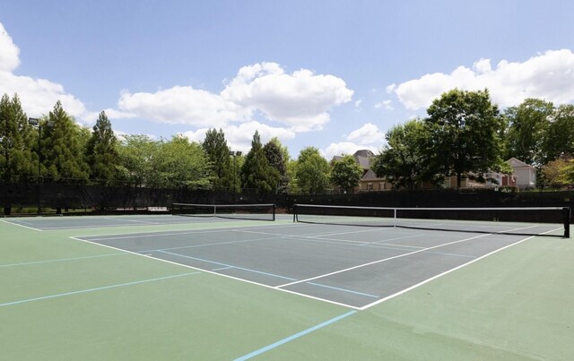 view of sport court with community basketball court and fence