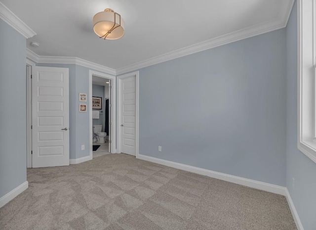 unfurnished bedroom featuring carpet, baseboards, and ornamental molding