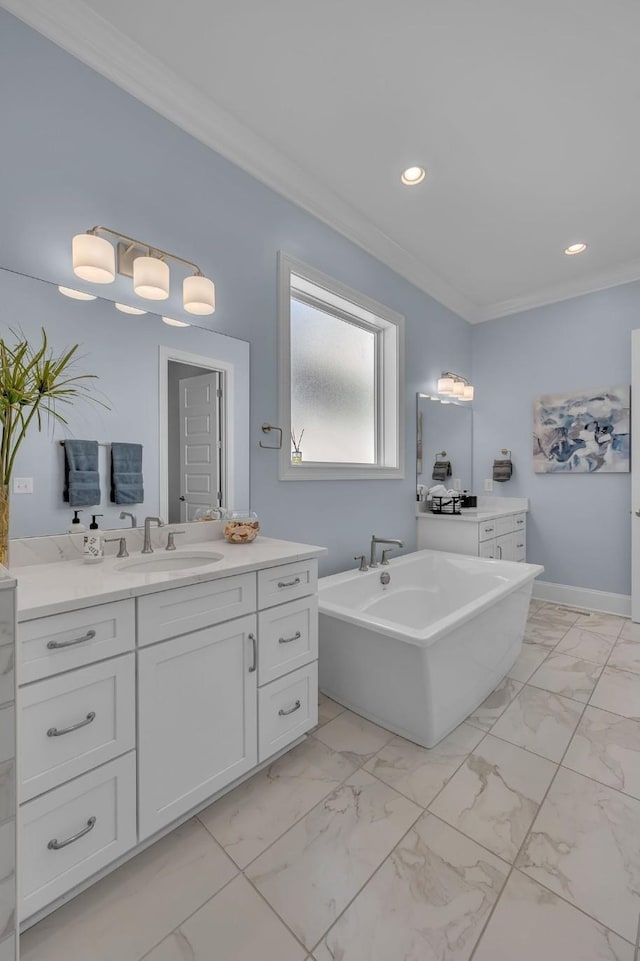 bathroom featuring marble finish floor, crown molding, and vanity
