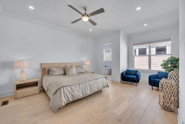bedroom with light wood-type flooring, baseboards, visible vents, and ornamental molding