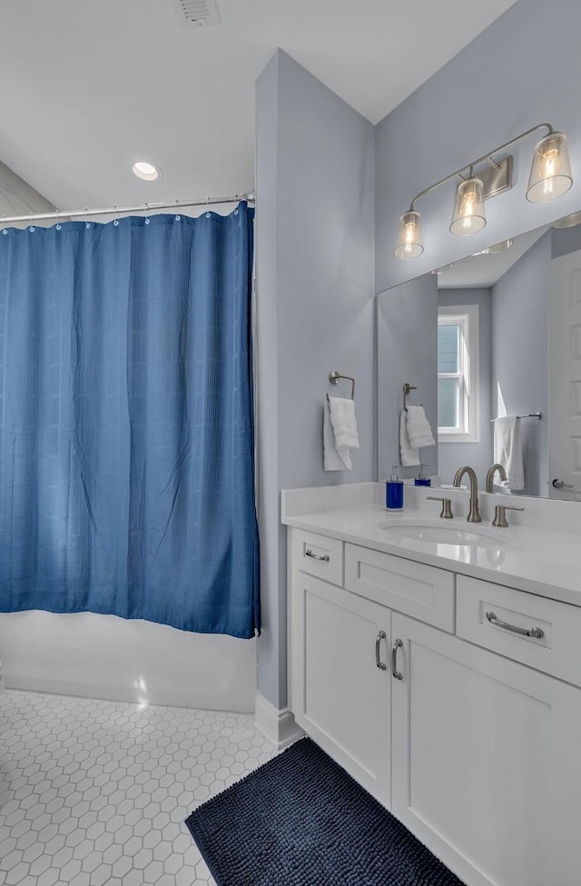 bathroom featuring shower / bath combo, vanity, and tile patterned floors