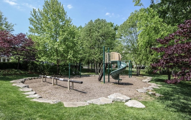 communal playground featuring a yard