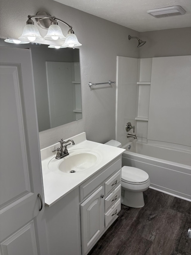 1669 Fellowship Rd, Mount Juliet, TN 37122 - bathroom featuring wood finished floors, vanity, washtub / shower combination, toilet, and visible vents