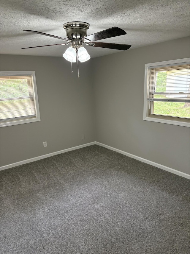 1669 Fellowship Rd, Mount Juliet, TN 37122 - empty room with dark colored carpet, a textured ceiling, baseboards, and ceiling fan