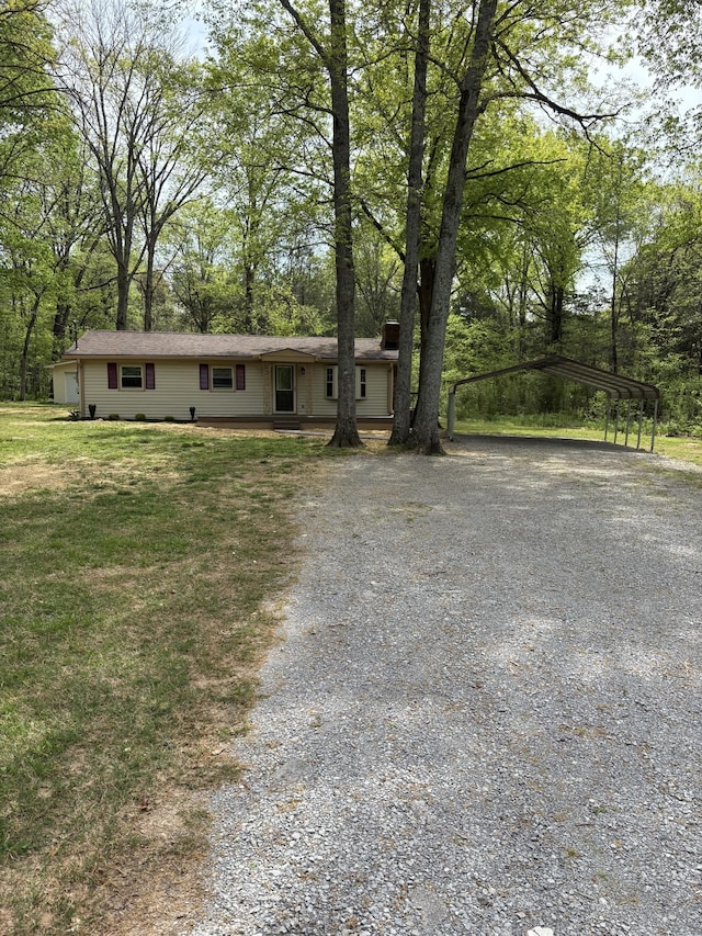 1669 Fellowship Rd, Mount Juliet, TN 37122 - ranch-style home with a carport, driveway, a chimney, and a front yard