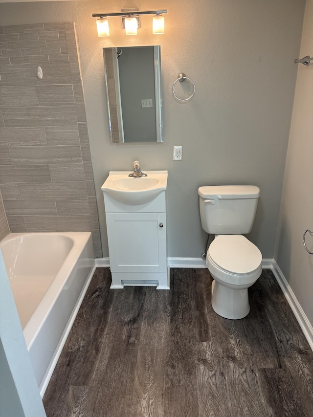 1669 Fellowship Rd, Mount Juliet, TN 37122 - bathroom with baseboards, wood finished floors, vanity, and toilet